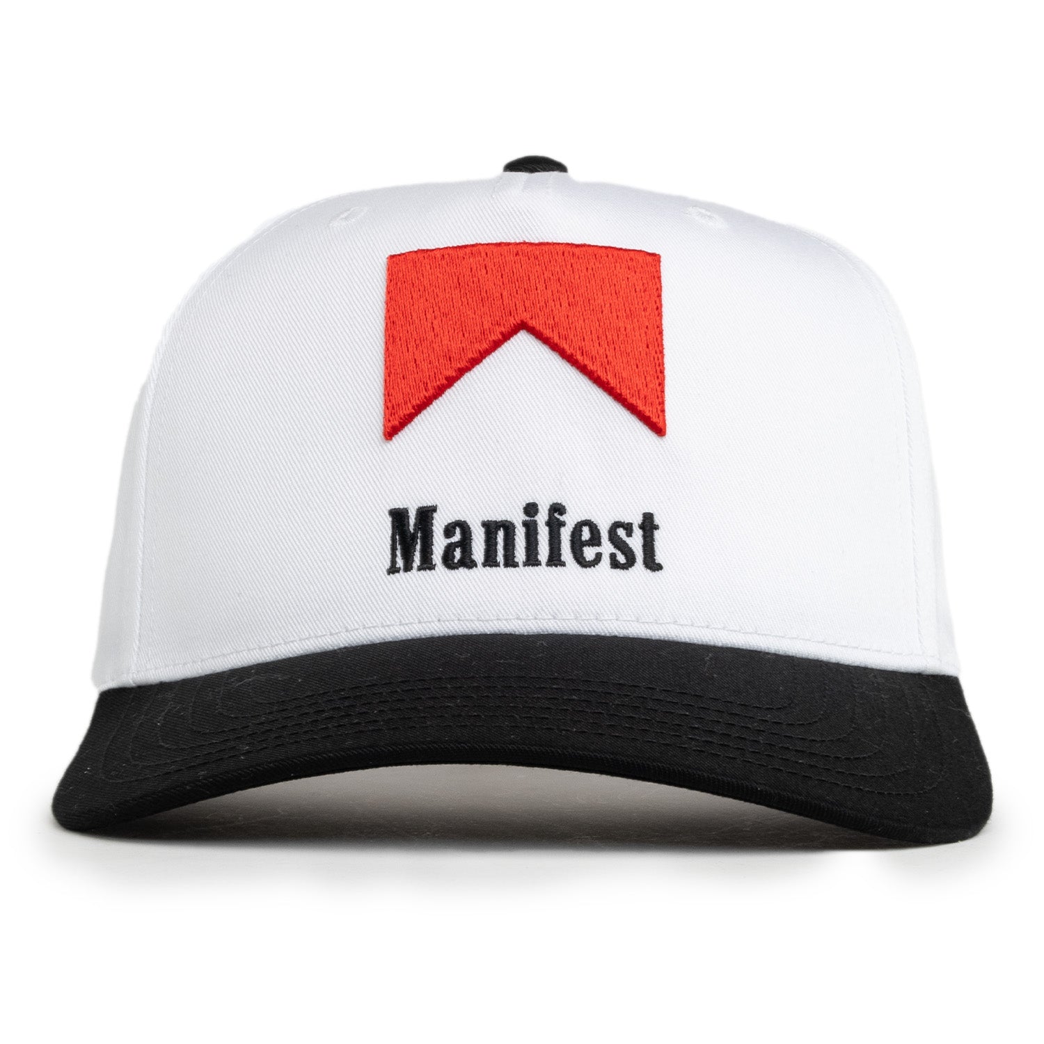A white baseball cap with a red geometric pattern and the word 'Manifest' written across the front.